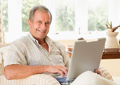 A man using his laptop. Links to What to Give A man using his laptop. Links to What to Give